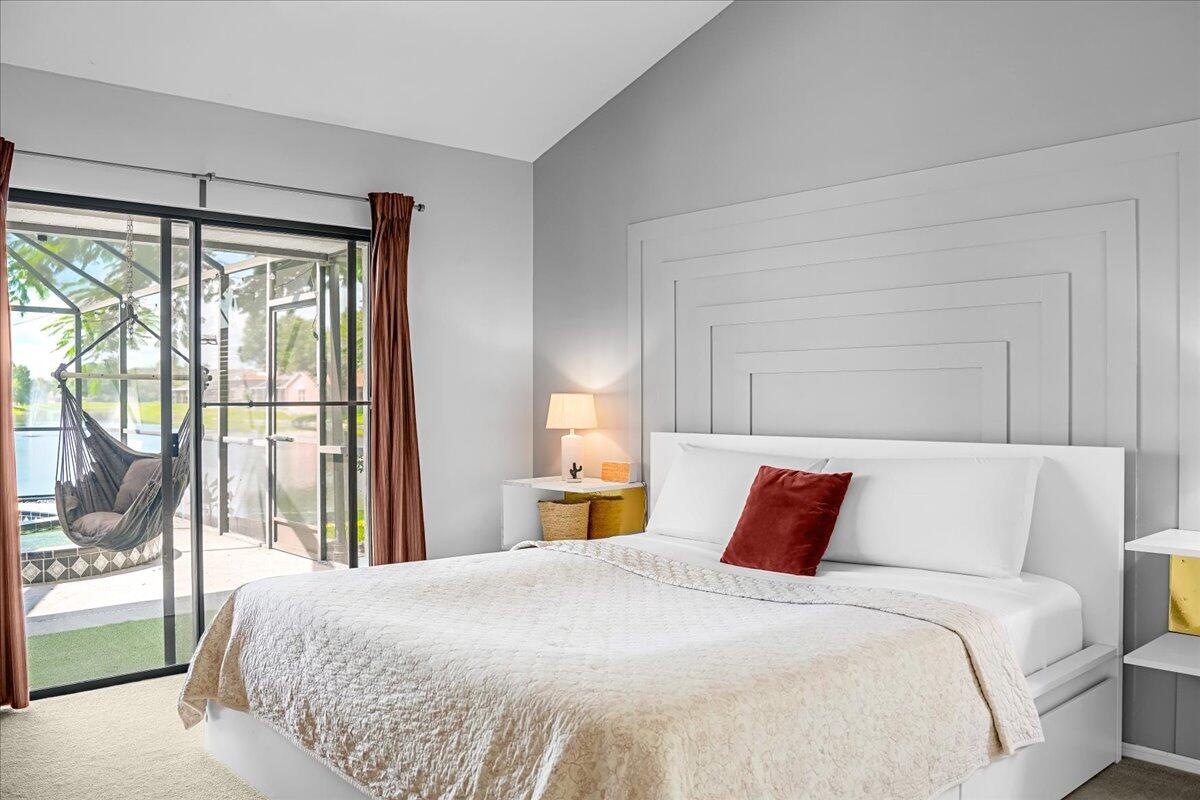 1901 Jacques Drive Melbourne, FL 32940 - Photo 38 of 43 a bedroom with a large bed and a large window