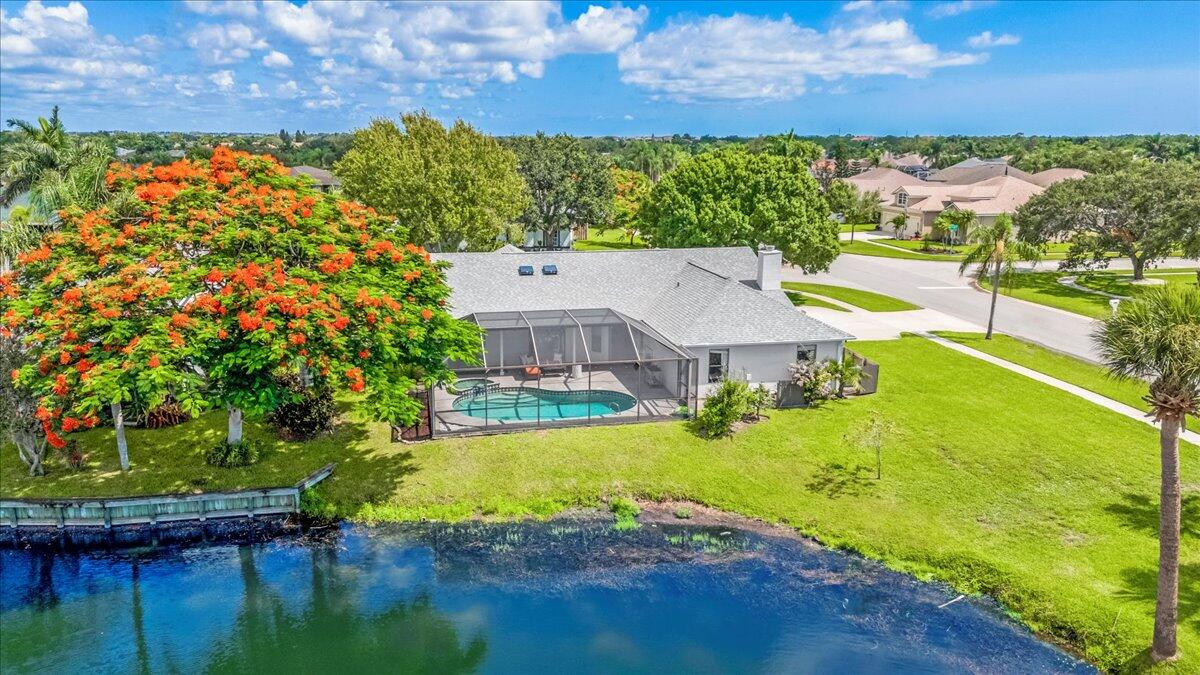 1901 Jacques Drive Melbourne, FL 32940 - Photo 4 of 43 a view of a lake with a house in the background