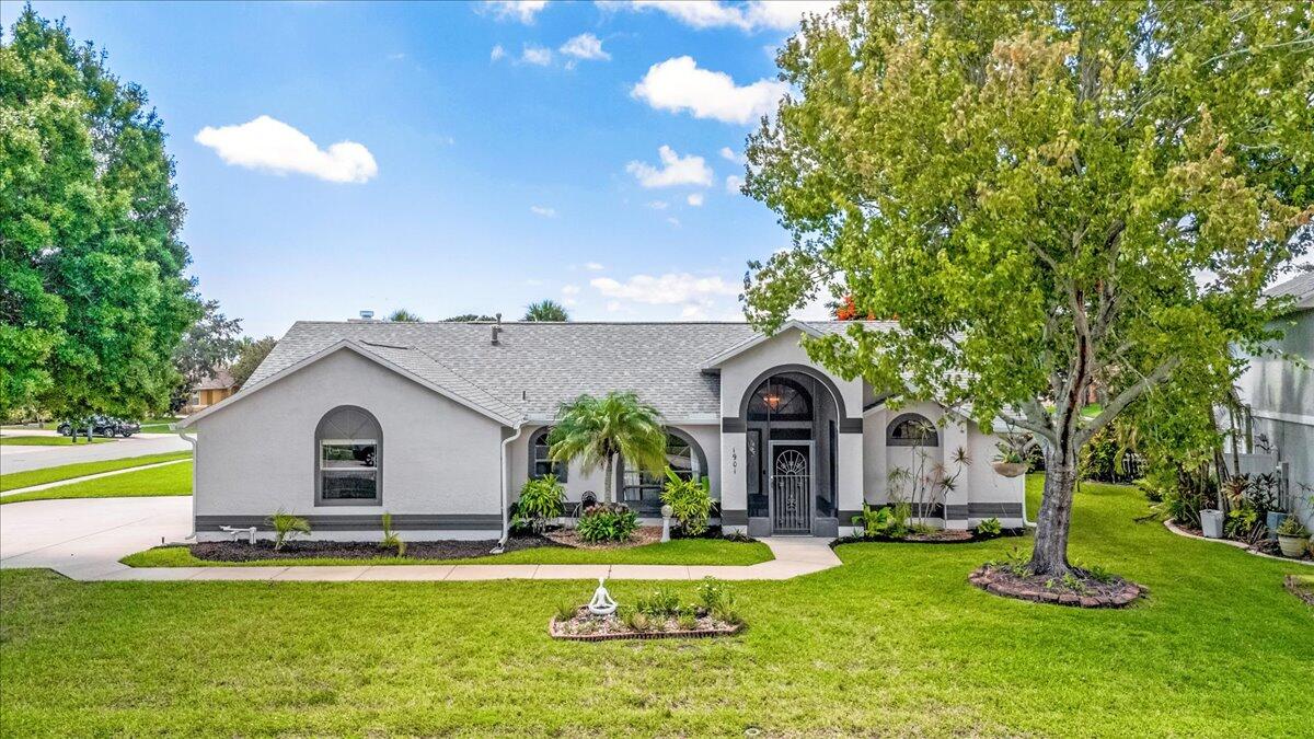 1901 Jacques Drive Melbourne, FL 32940 - Photo 42 of 43 a view of a house with swimming pool and a garden