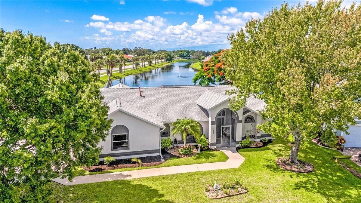 1901 Jacques Drive Melbourne, FL 32940 - Photo 7 of 43 a view of a house with a yard patio and fire pit