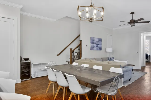 a view of a kitchen counter space a sink and wooden floor