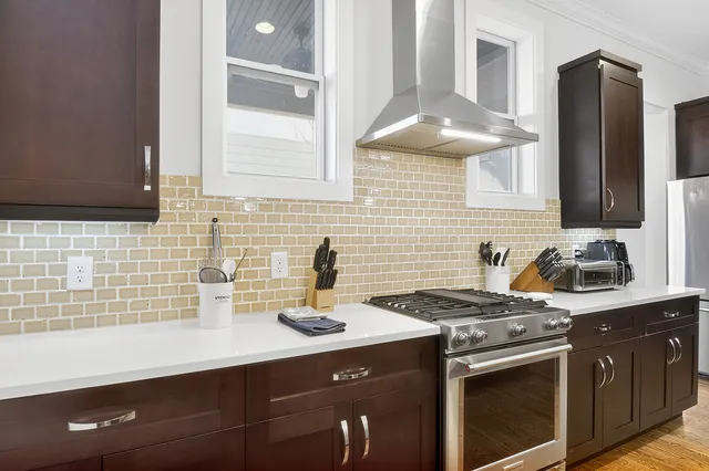 a bedroom with a bed and painting on the wall