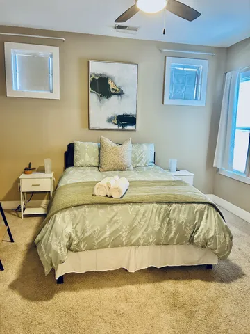 a white toilet sitting next to a bath tub