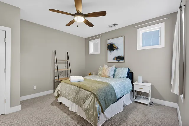 a bathroom with a double vanity sink and mirror