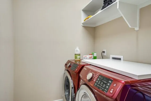 a living room with furniture and a dresser