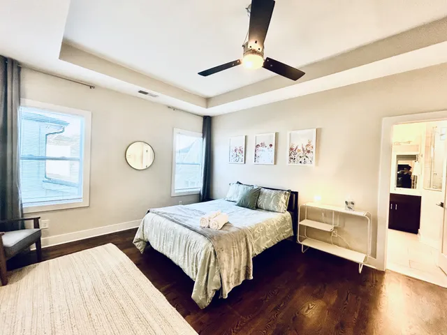 a bathroom with a double vanity sink a mirror and shower