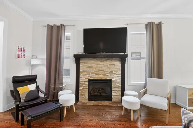 a bedroom with a bed and a chair