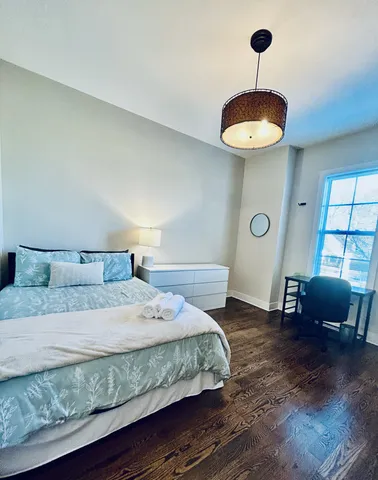 a bath tub sitting next to a white toilet