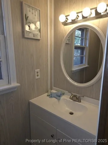 a bathroom with a sink and mirror
