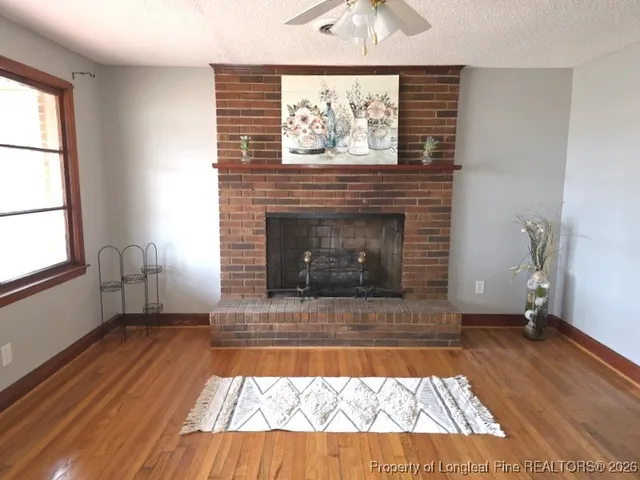 a living room with a couch and a fireplace