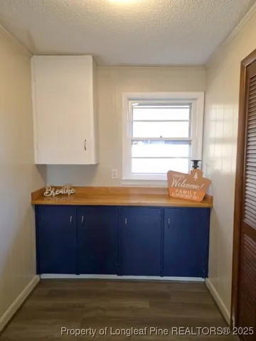 a room with a dresser and a wooden floor