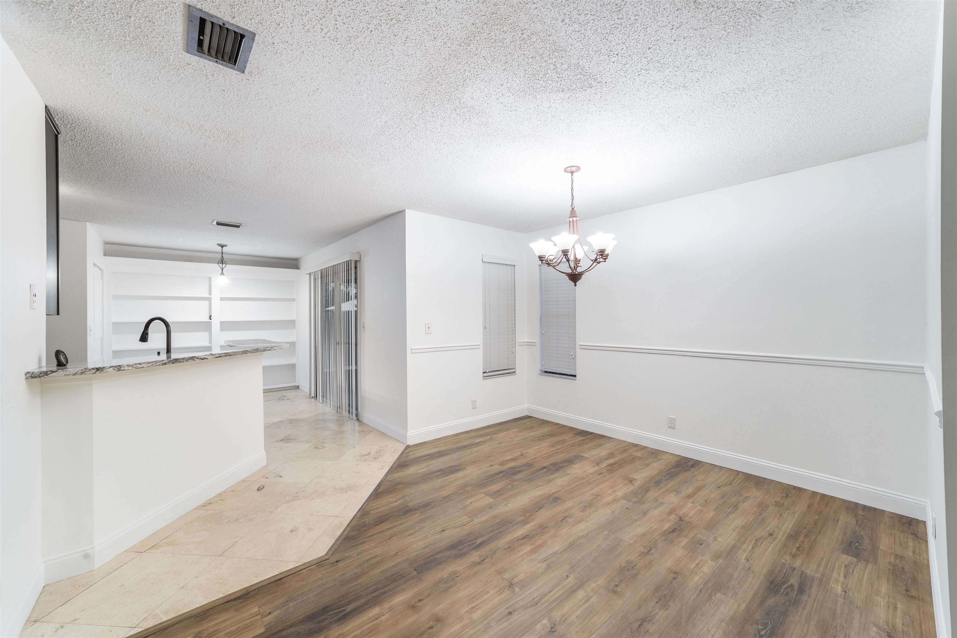 111 Lobelia Road St. Augustine, FL 32086 - Photo 12 of 46 a view of a kitchen with a sink and a refrigerator