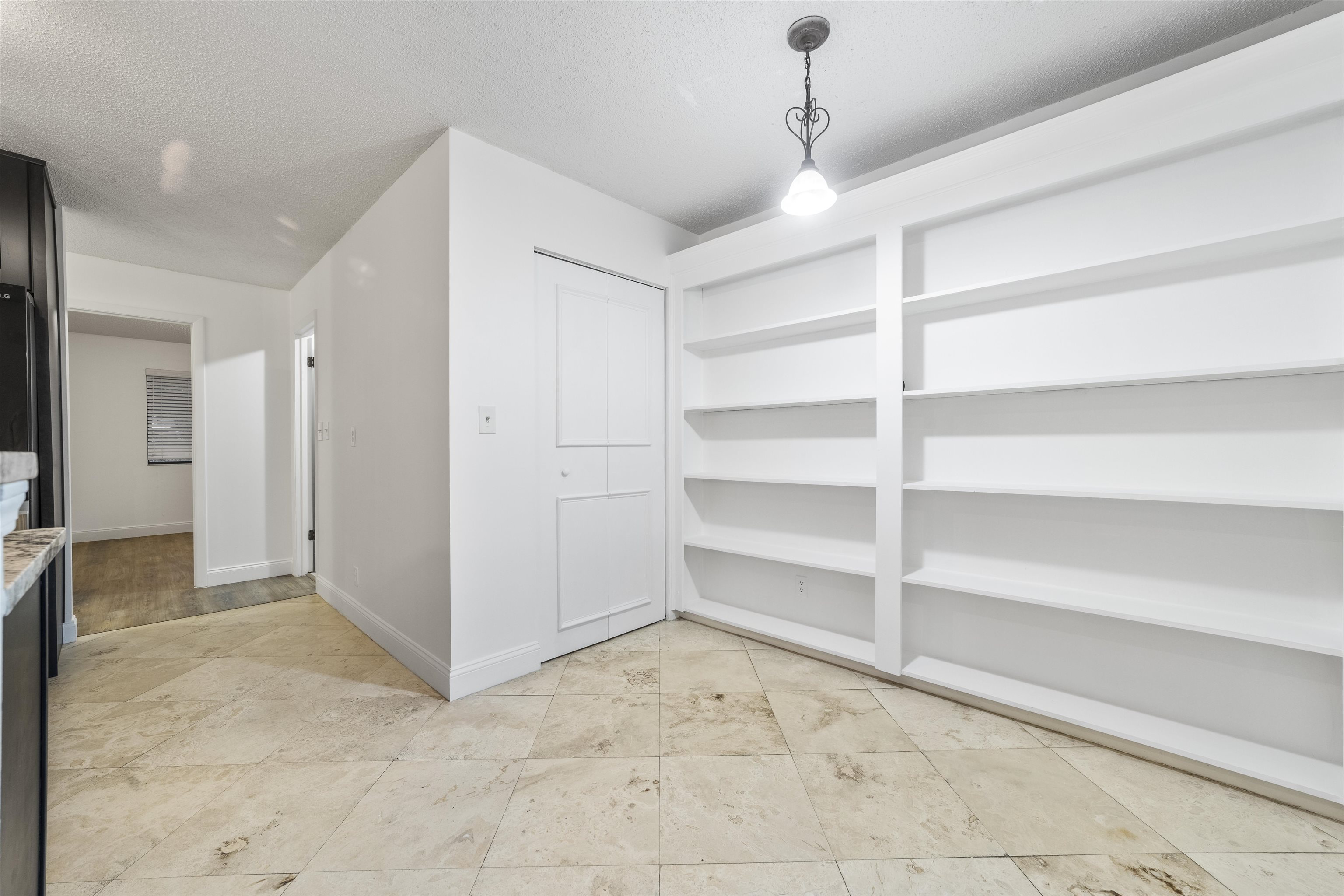 111 Lobelia Road St. Augustine, FL 32086 - Photo 14 of 46 a view of an empty room with a cabinet