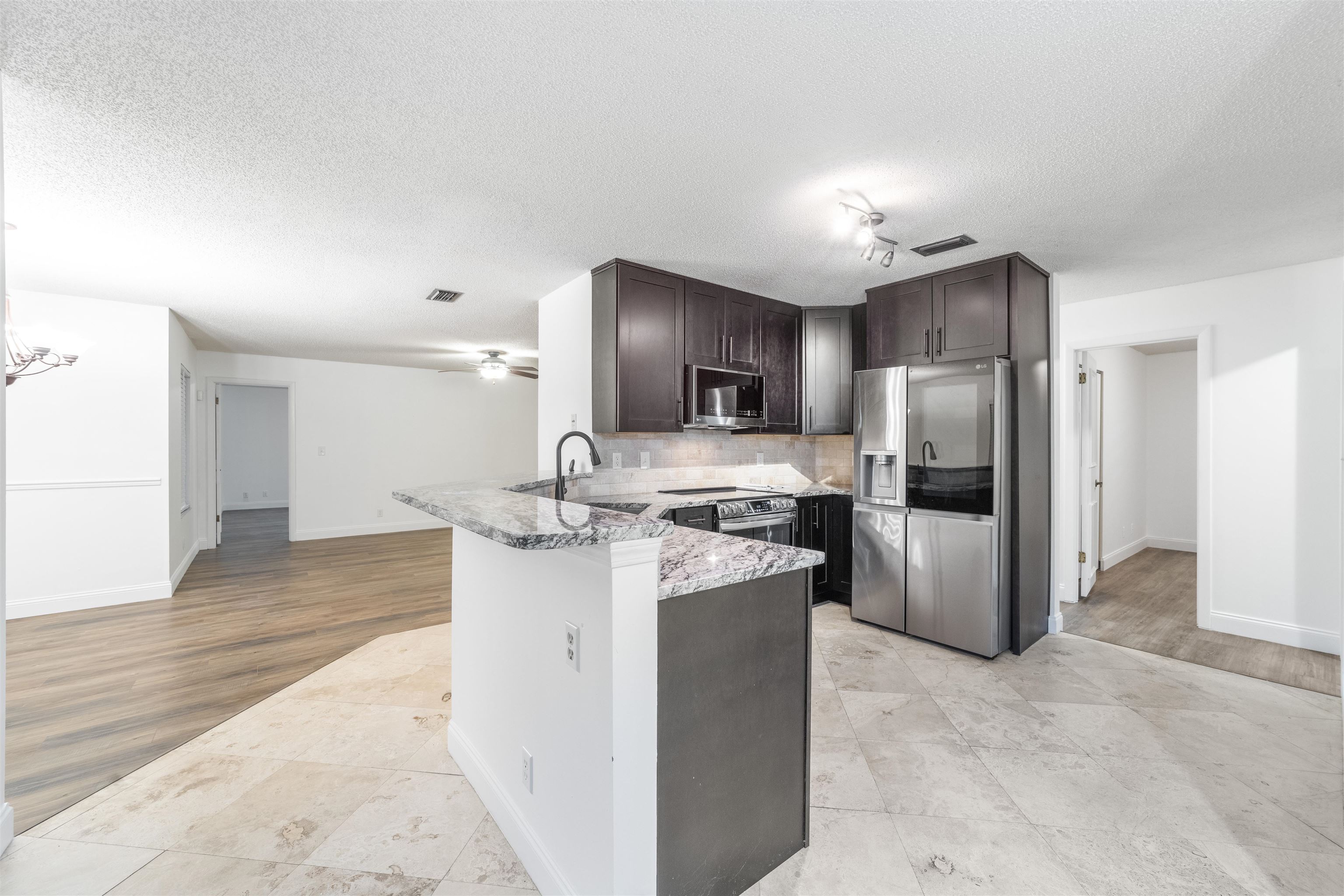 111 Lobelia Road St. Augustine, FL 32086 - Photo 18 of 46 a kitchen with a refrigerator sink and stove