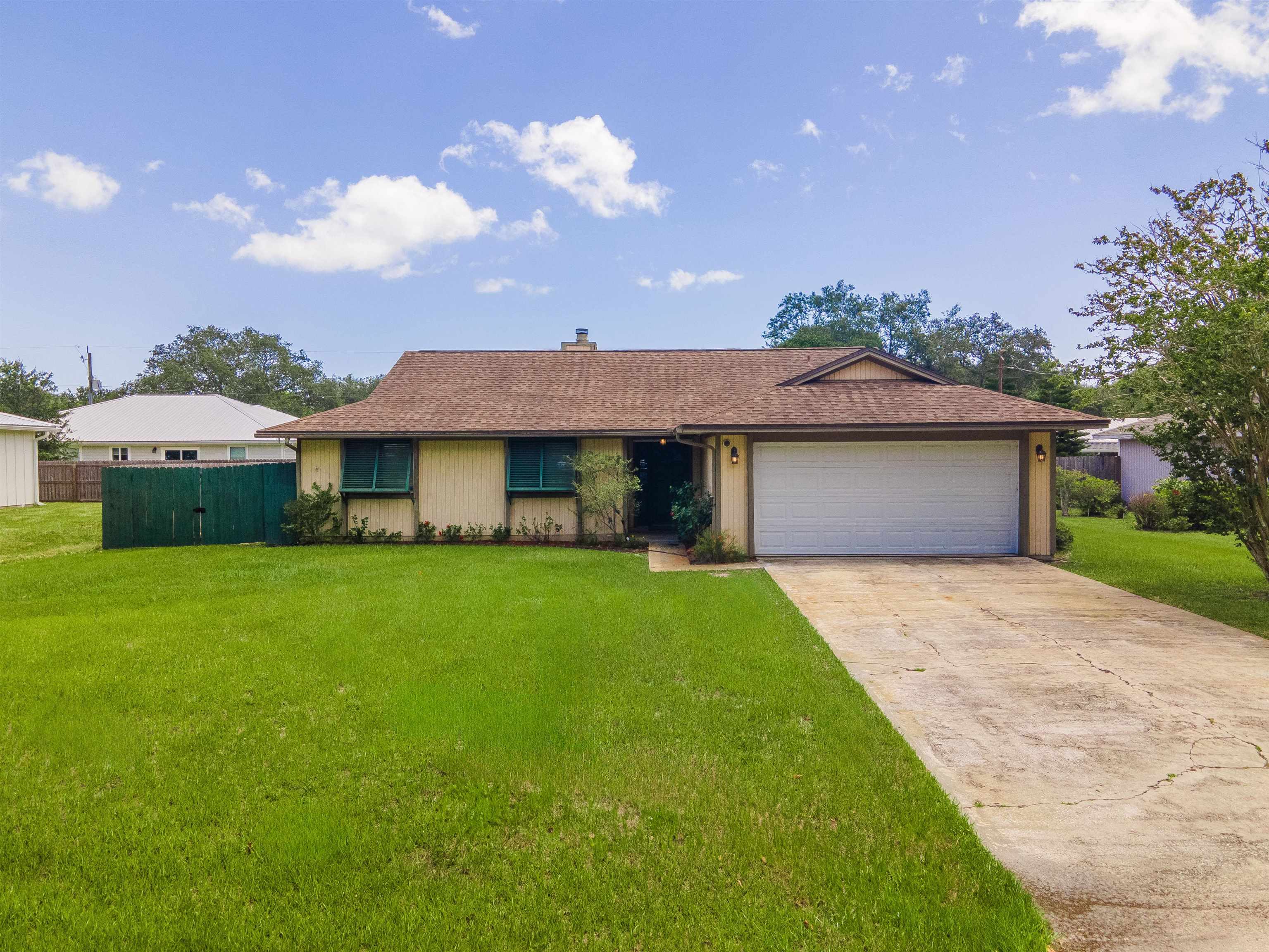111 Lobelia Road St. Augustine, FL 32086 - Photo 2 of 46 a front view of a house with a yard and garage