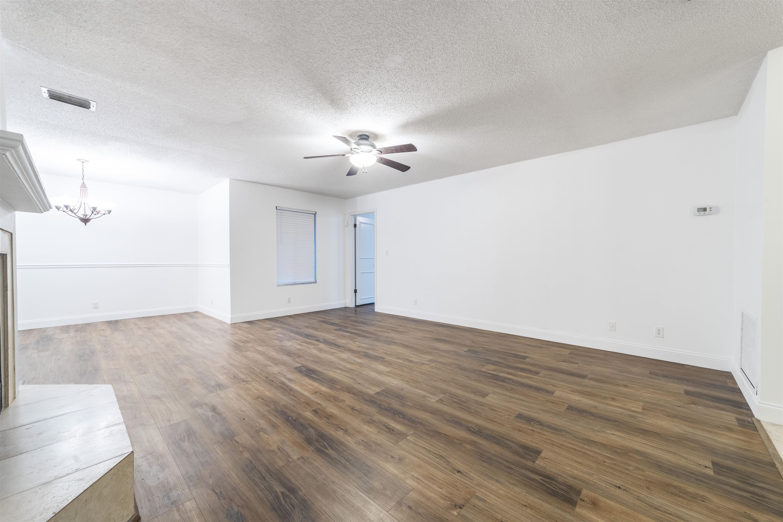 111 Lobelia Road St. Augustine, FL 32086 - Photo 22 of 46 a view of an empty room with a chandelier fan