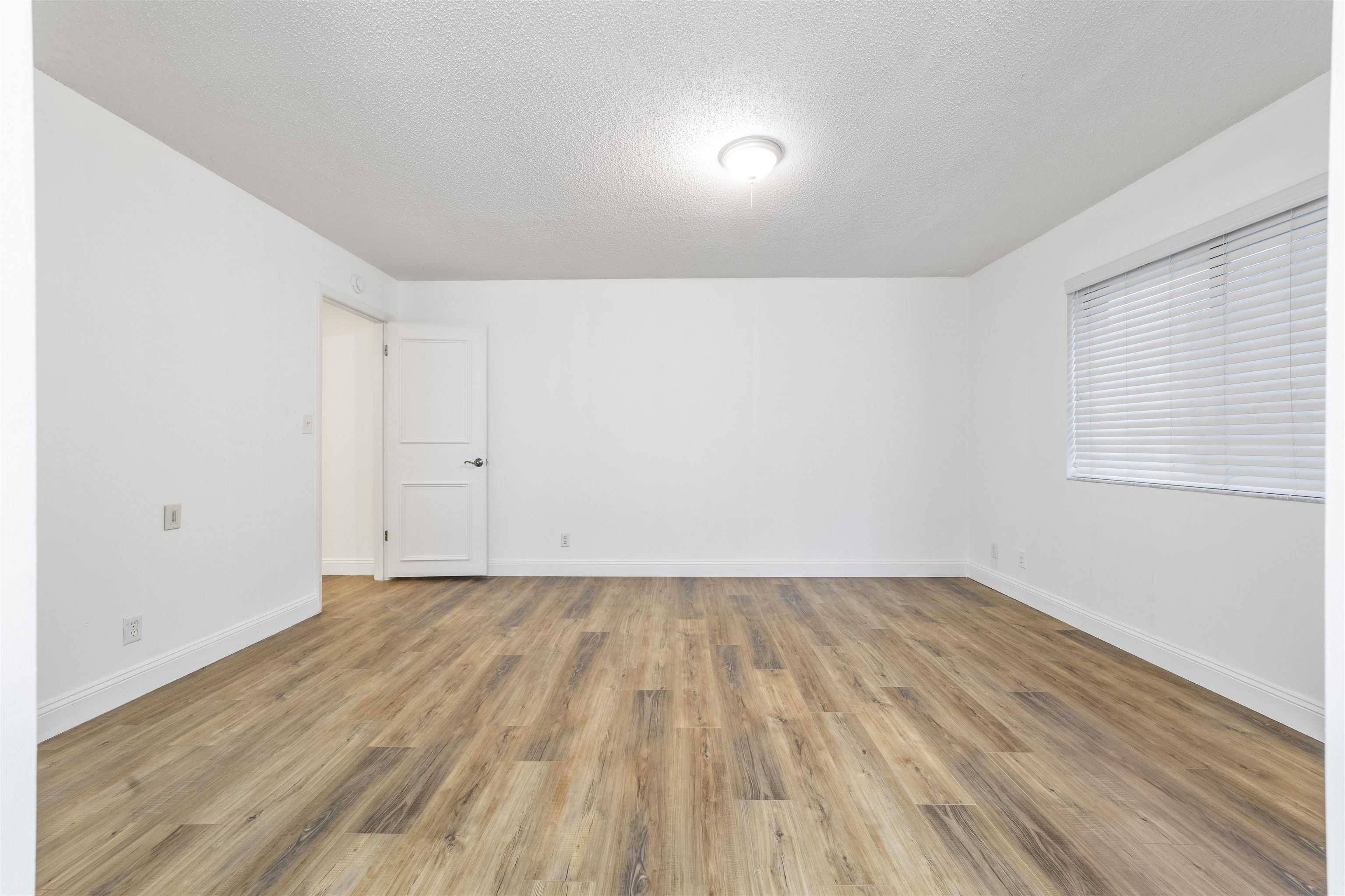 111 Lobelia Road St. Augustine, FL 32086 - Photo 25 of 46 a view of an empty room with wooden floor