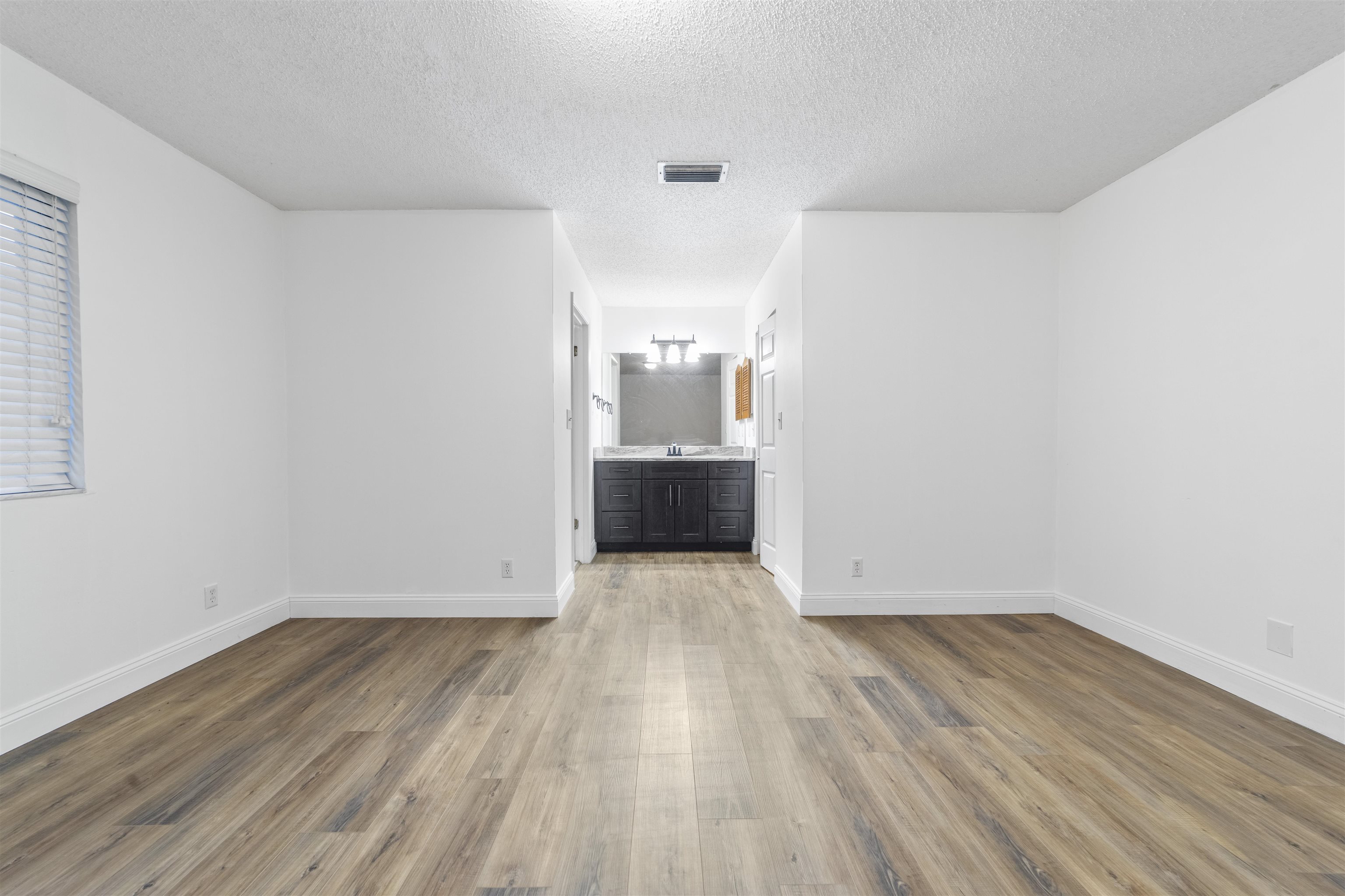 111 Lobelia Road St. Augustine, FL 32086 - Photo 26 of 46 an empty room with wooden floor and sink
