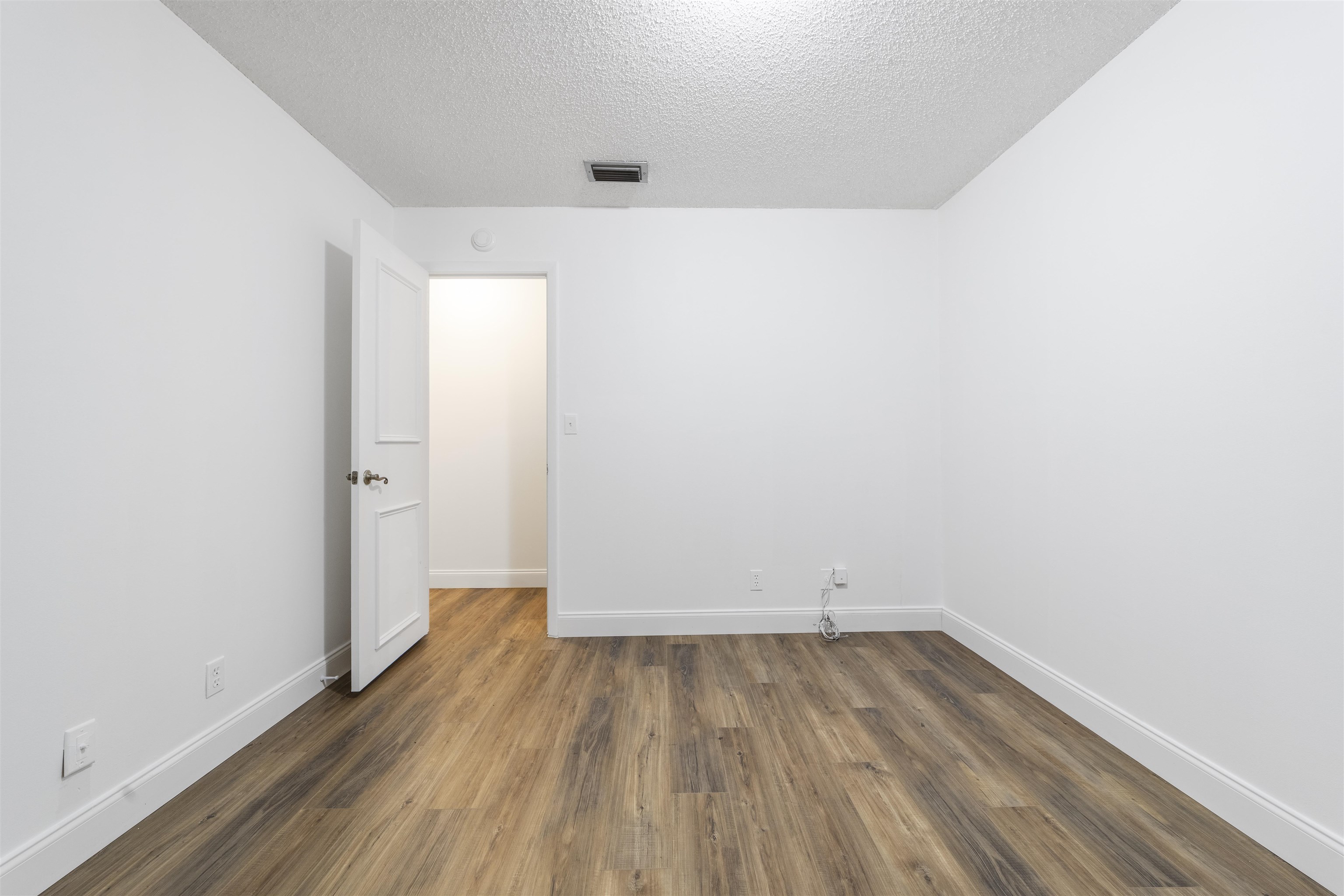 111 Lobelia Road St. Augustine, FL 32086 - Photo 33 of 46 an empty room with wooden floor