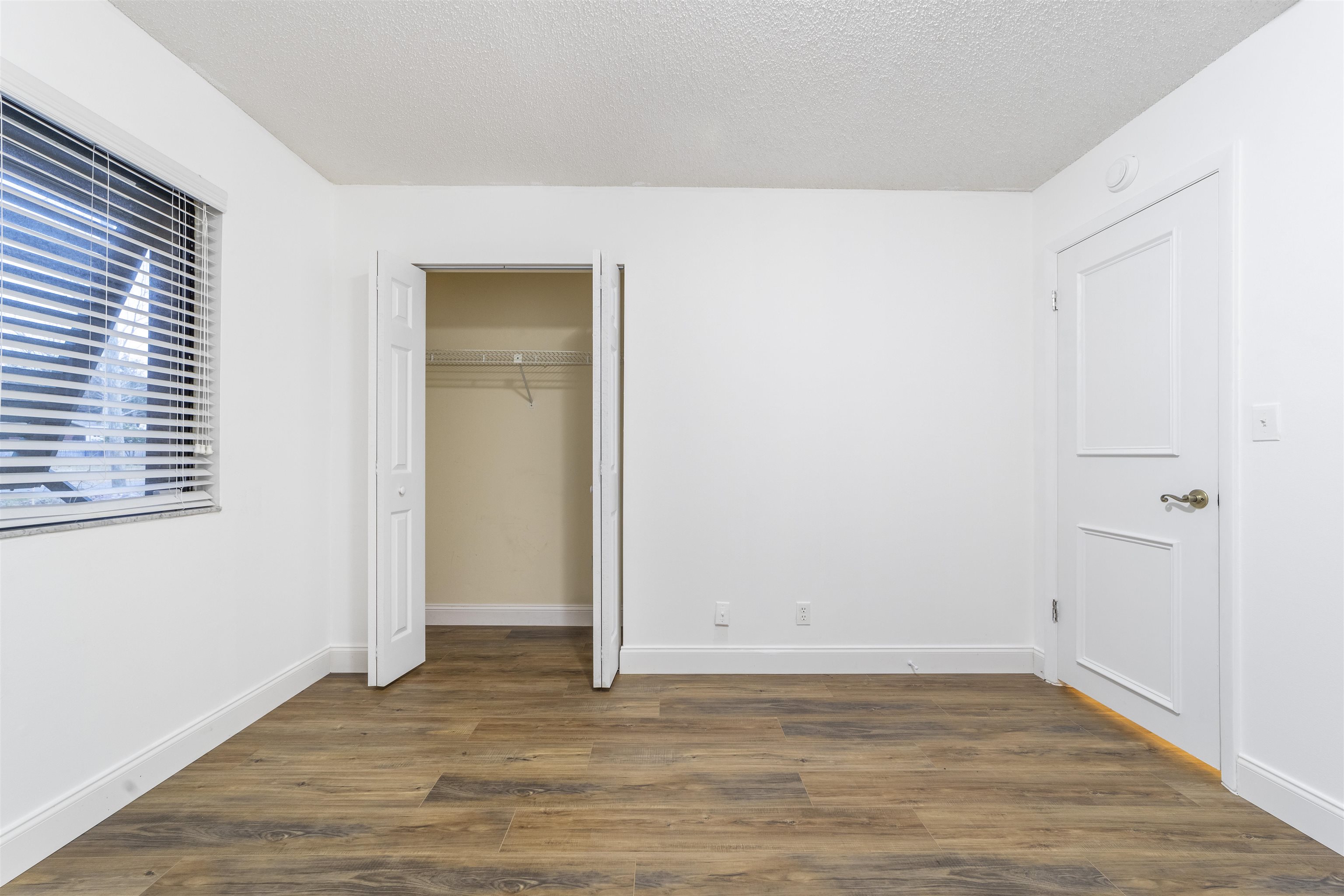 111 Lobelia Road St. Augustine, FL 32086 - Photo 34 of 46 a view of an empty room with wooden floor and a window