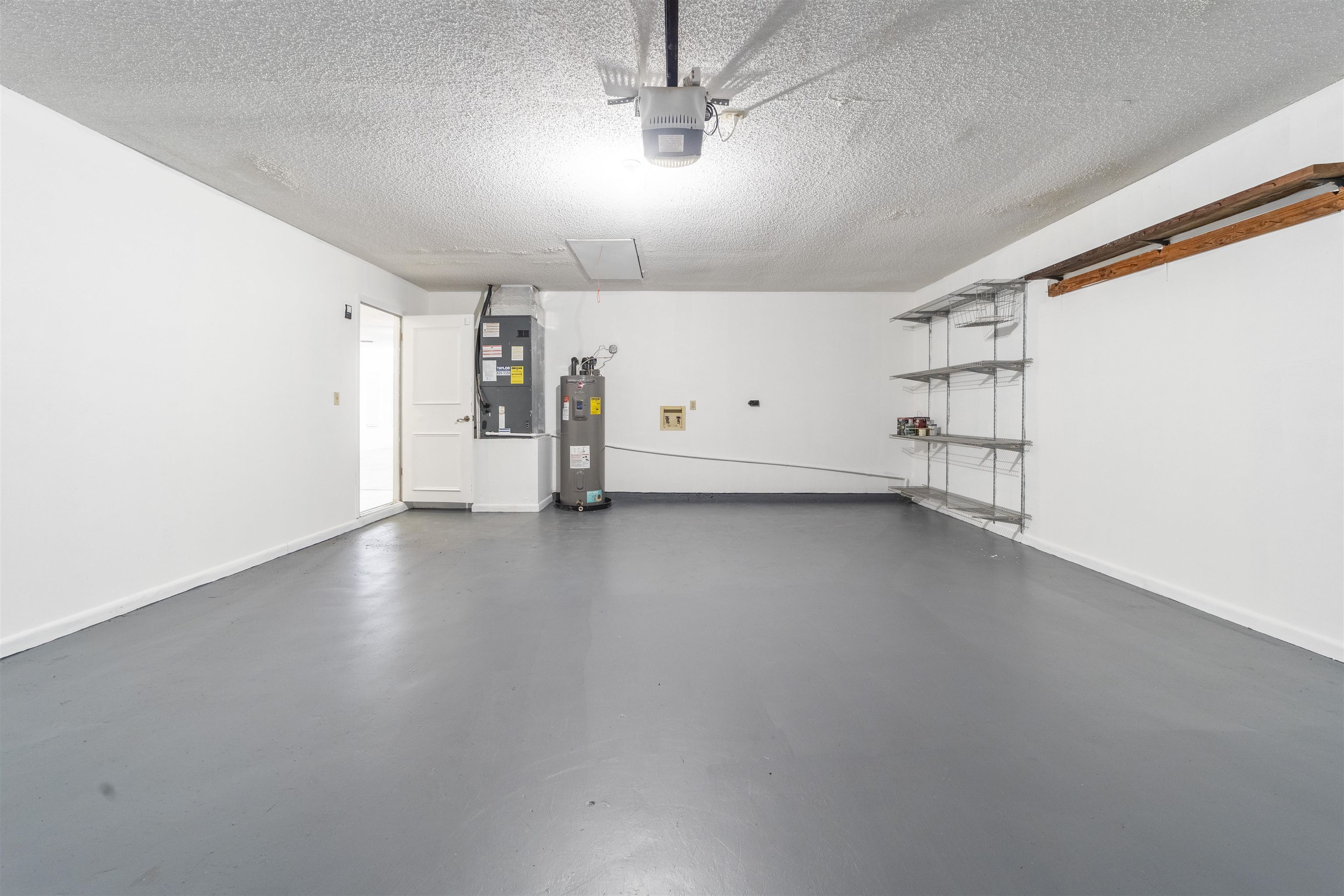 111 Lobelia Road St. Augustine, FL 32086 - Photo 39 of 46 a view of a livingroom with wooden floor and white walls