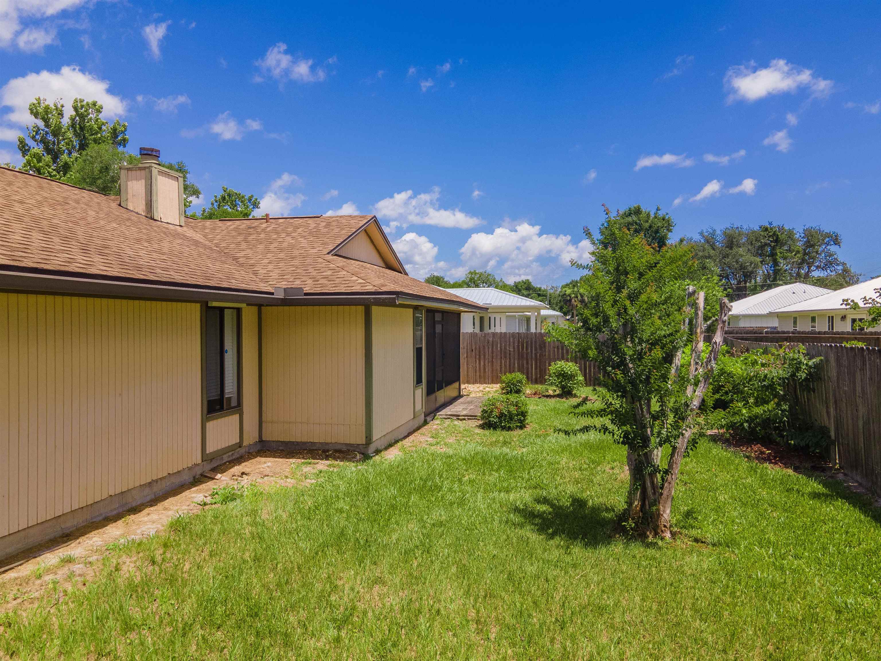 111 Lobelia Road St. Augustine, FL 32086 - Photo 44 of 46 a view of a backyard with plants and large tree