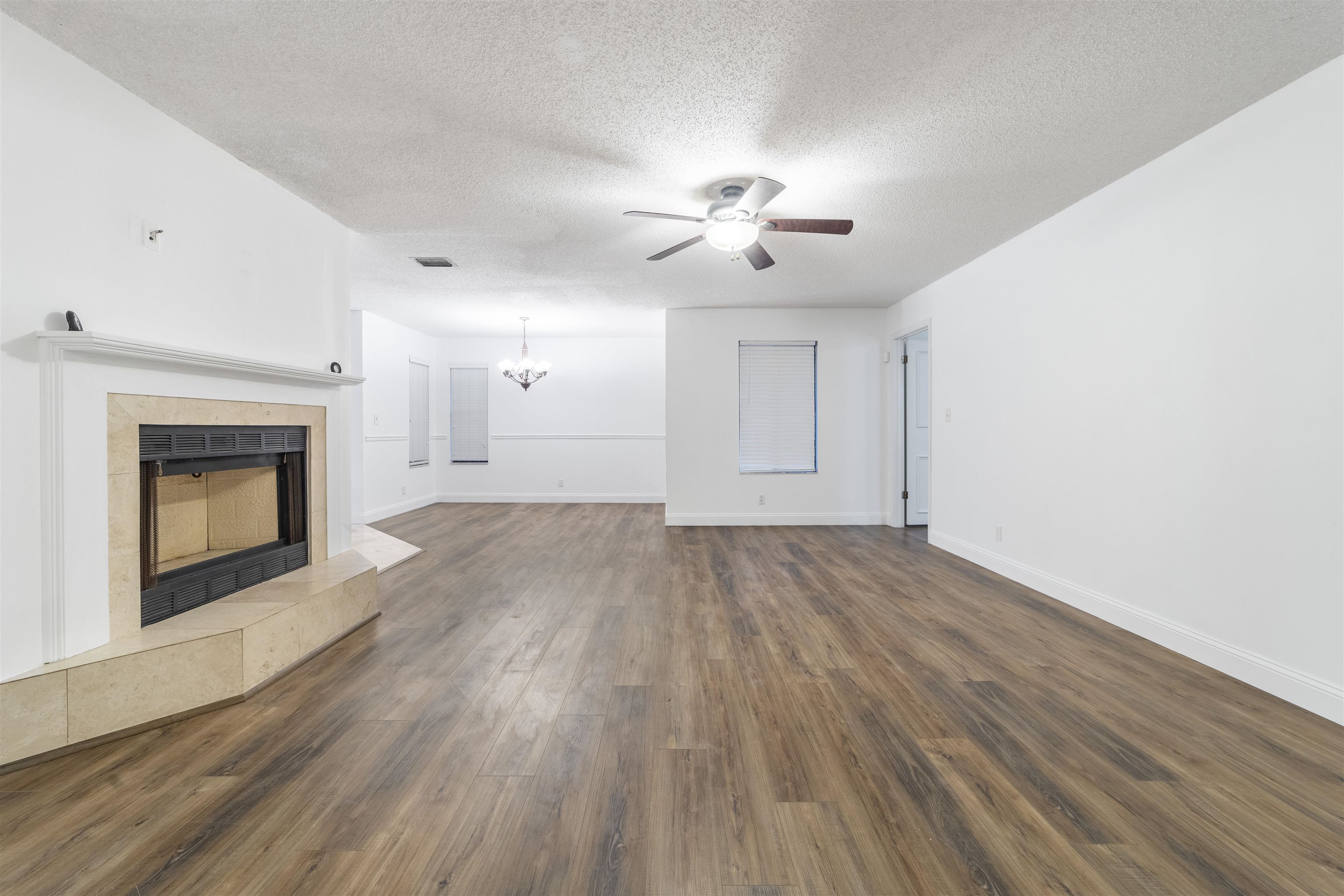 111 Lobelia Road St. Augustine, FL 32086 - Photo 8 of 46 a view of empty room with wooden floor and fireplace