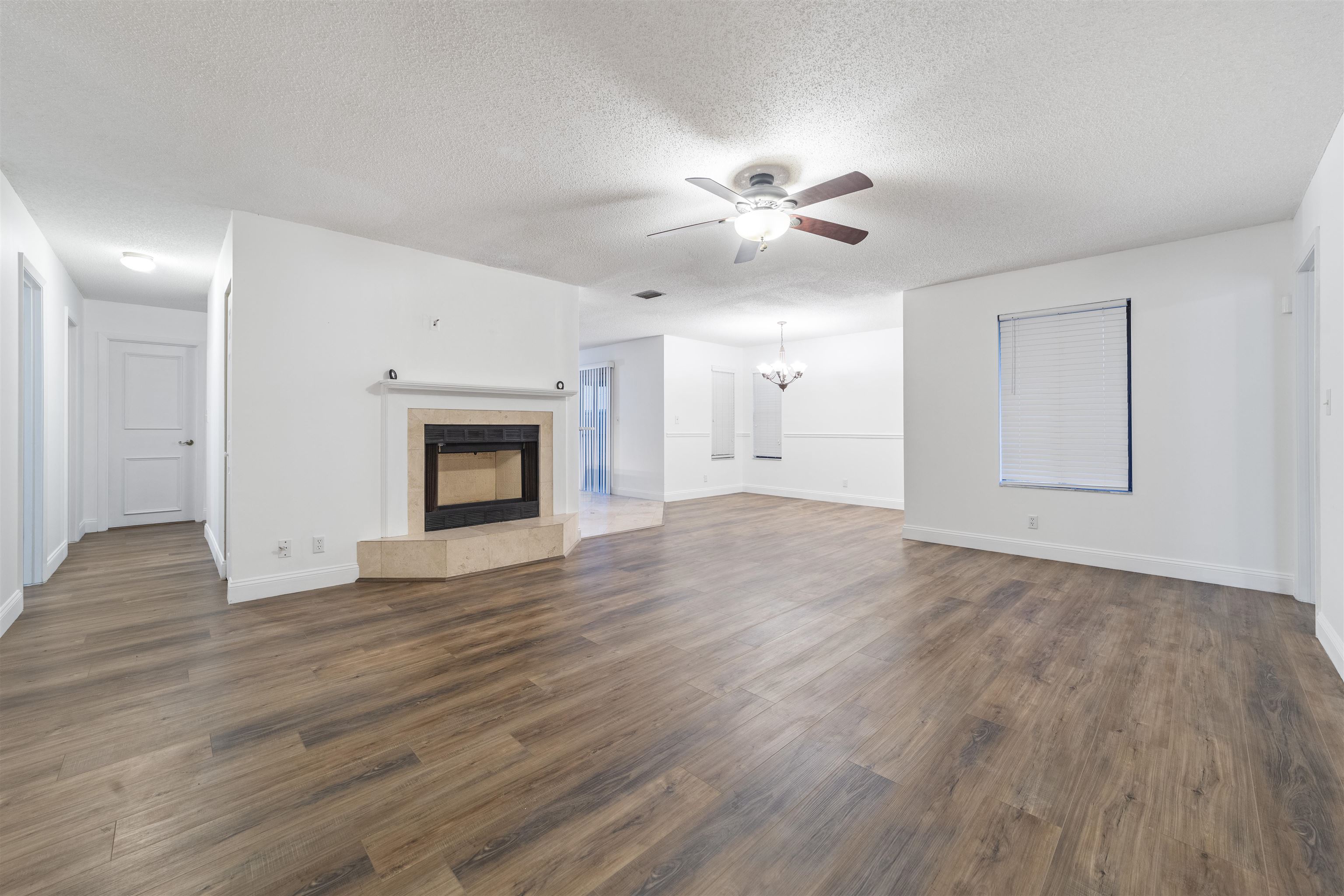 111 Lobelia Road St. Augustine, FL 32086 - Photo 9 of 46 a view of an empty room with wooden floor and a window