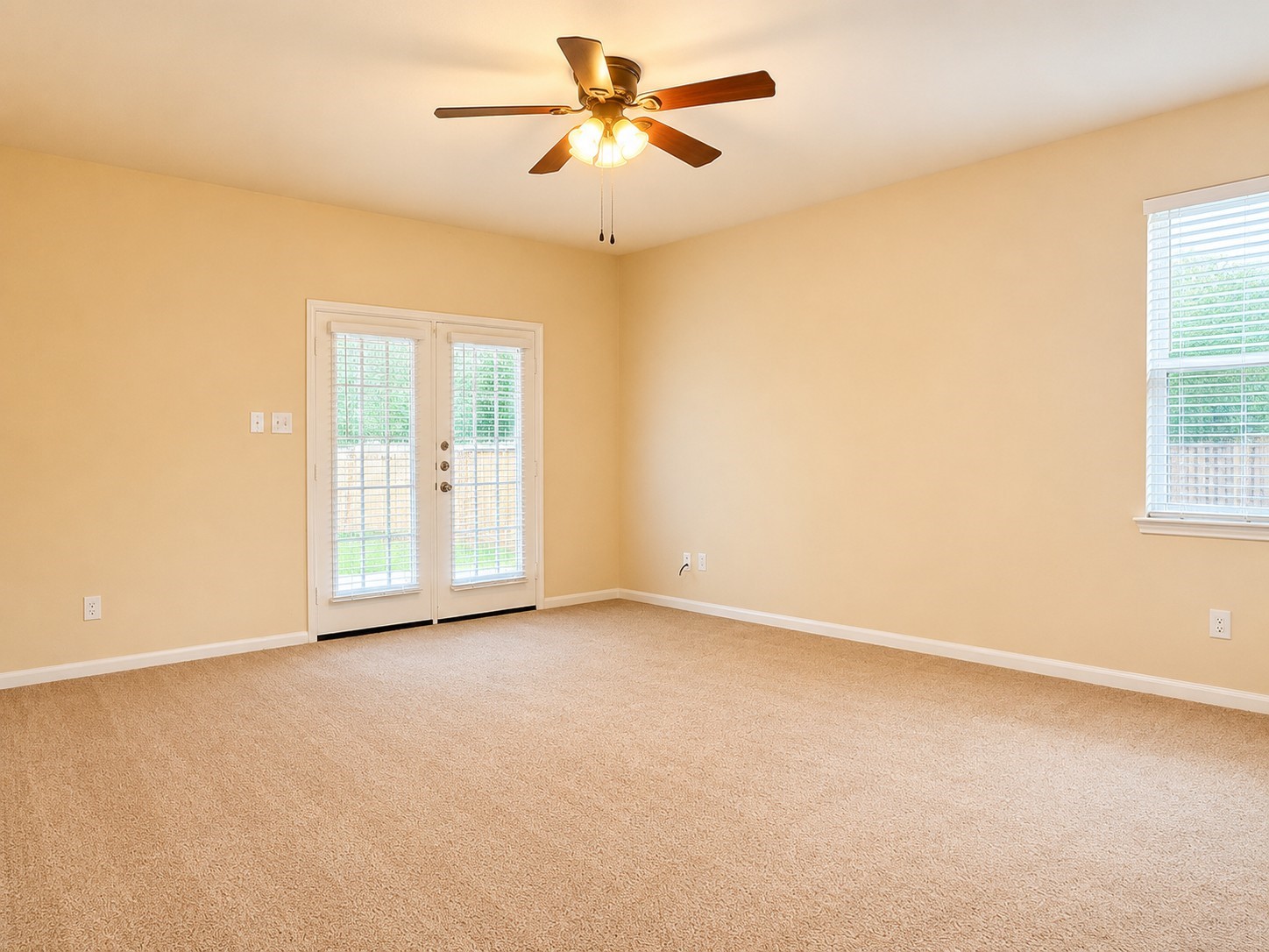 7599 Fettle Lane Conroe, TX 77304 - Photo 6 of 15 an empty room with windows and fan
