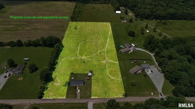 an aerial view of a residential houses with outdoor space