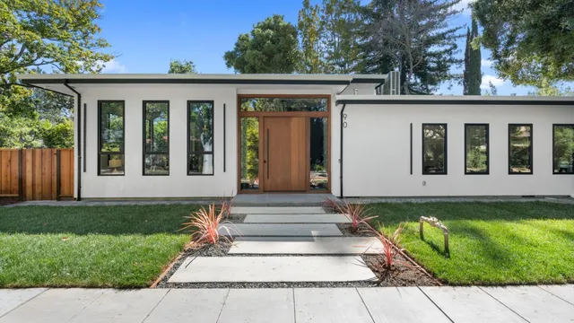 a front view of a house with garden
