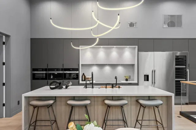 a bathroom with a sink a potted plant and a window