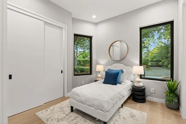 a living room filled with furniture and a floor to ceiling window