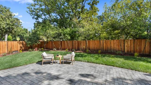 a kitchen with stainless steel appliances a sink and a white cabinets
