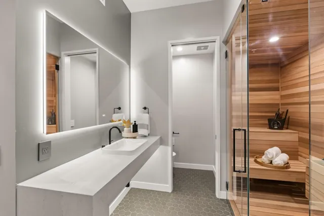 a bathroom with a sink and a mirror