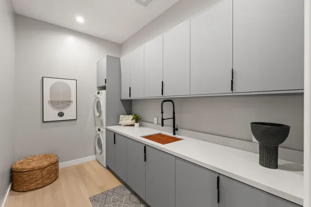 a bedroom with a bed and a painting on the wall