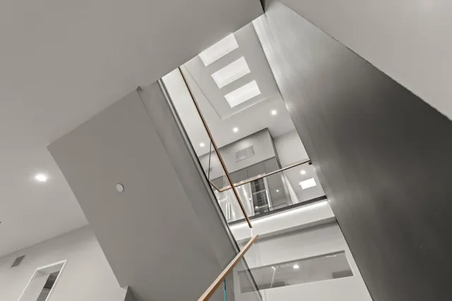a living room with kitchen island furniture and a flat screen tv