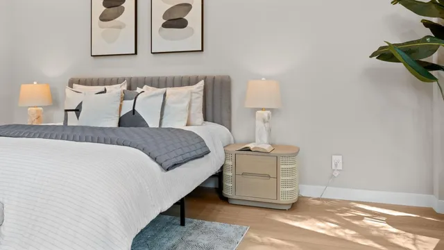 a view of a hallway with wooden floor and closet
