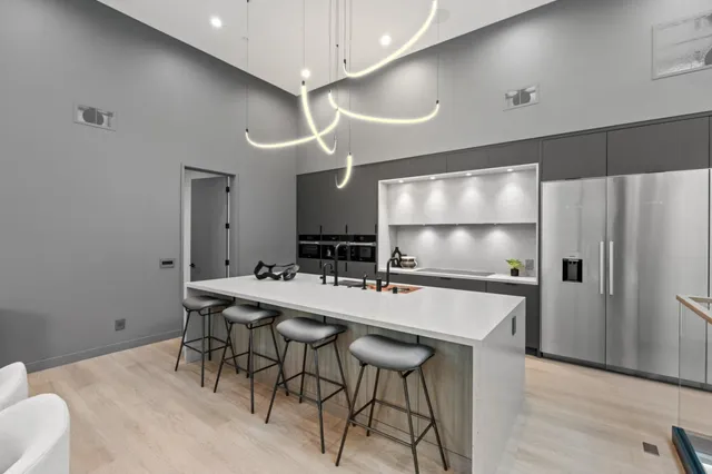 a kitchen with a table and chairs in it