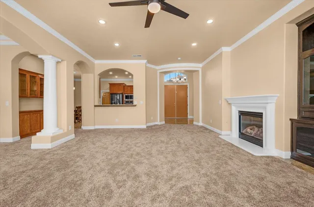 a view of a kitchen with a sink and a large window