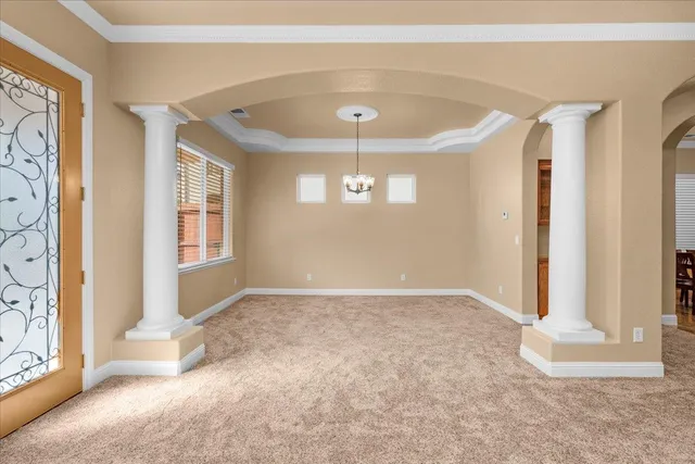 a view of a hallway with a flat screen tv