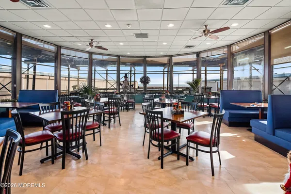 a view of a room with lots of white furniture