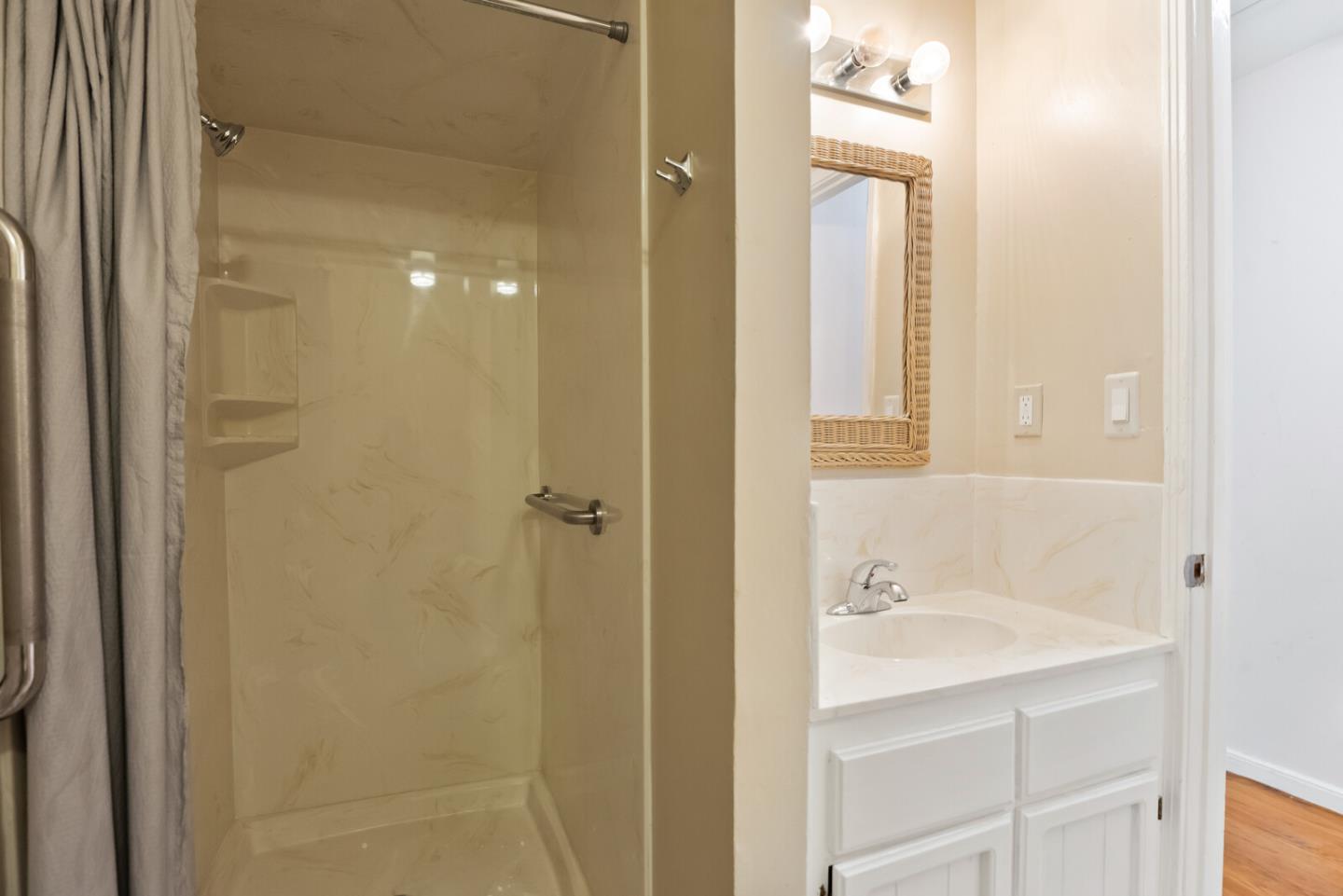 854 Cambridge Avenue Menlo Park, CA 94025 - Photo 16 of 18 a bathroom with a sink and a mirror