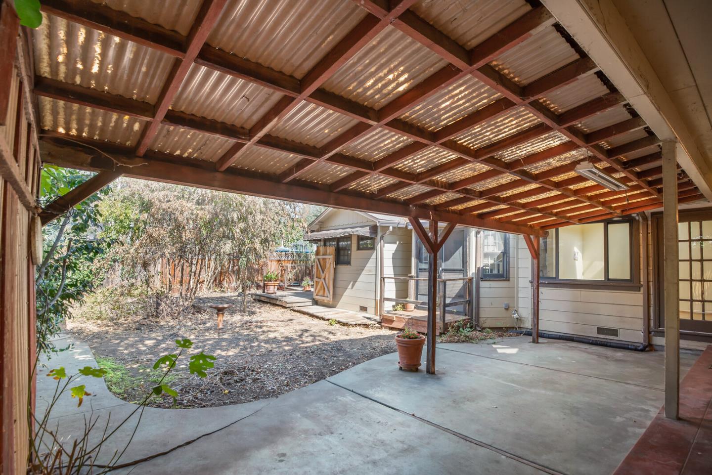 854 Cambridge Avenue Menlo Park, CA 94025 - Photo 17 of 18 a view of a porch with furniture and a backyard