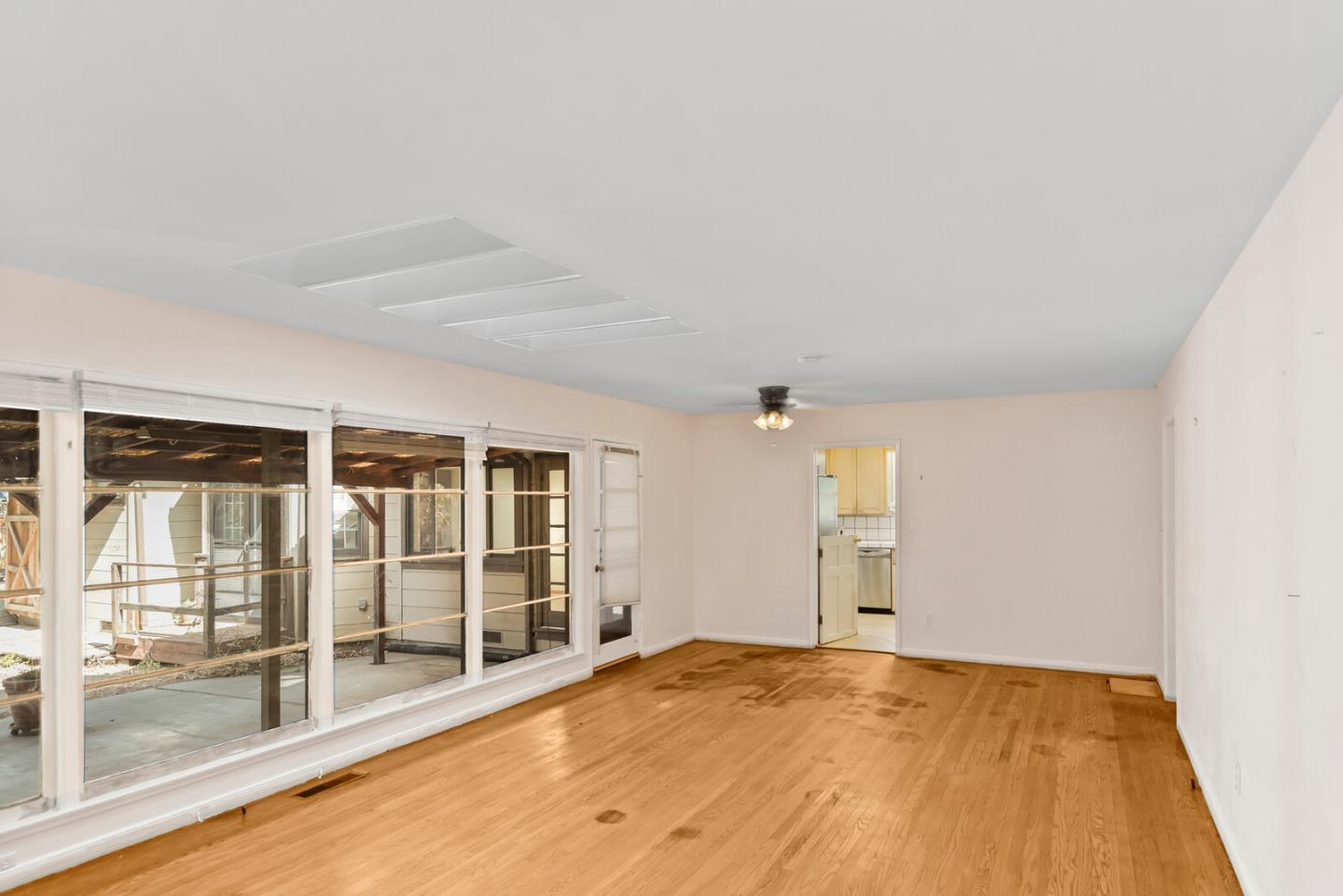 854 Cambridge Avenue Menlo Park, CA 94025 - Photo 3 of 18 an empty room with wooden floor and windows