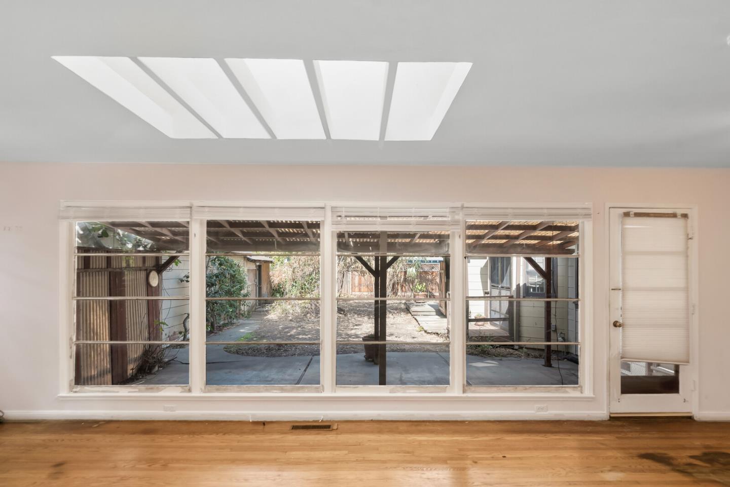 854 Cambridge Avenue Menlo Park, CA 94025 - Photo 4 of 18 a view of a livingroom with wooden floor and a window