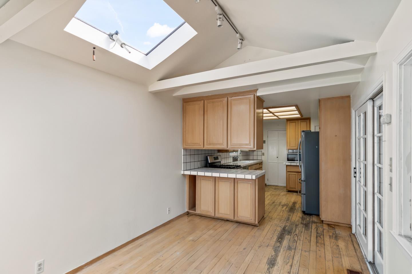 854 Cambridge Avenue Menlo Park, CA 94025 - Photo 5 of 18 a kitchen with stainless steel appliances granite countertop a stove and a refrigerator