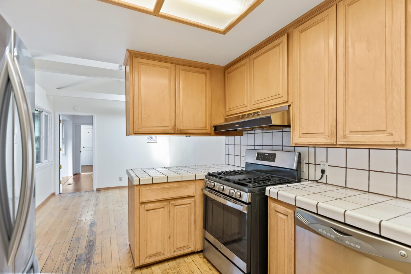854 Cambridge Avenue Menlo Park, CA 94025 - Photo 8 of 18 a kitchen with granite countertop cabinets stainless steel appliances and a counter space