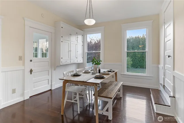 a table room with furniture and wooden floor