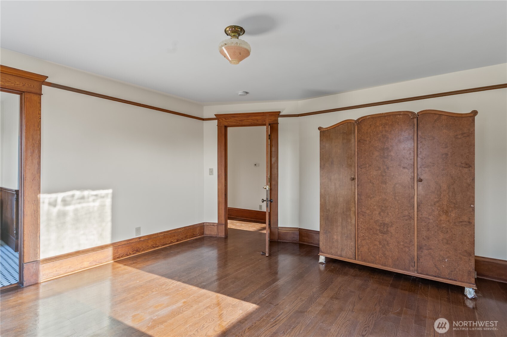1371 West Axton Road Ferndale, WA 98248 - Photo 24 of 40 a view of an empty room with wooden floor and a window
